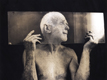 man and glass, selenium toned print